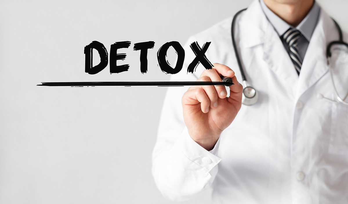 doctor writing detox to explain detox meaning