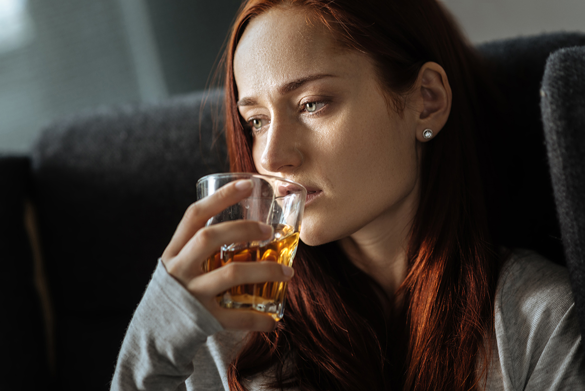 young woman drinking alcohol wondering Am I Struggling with Addiction