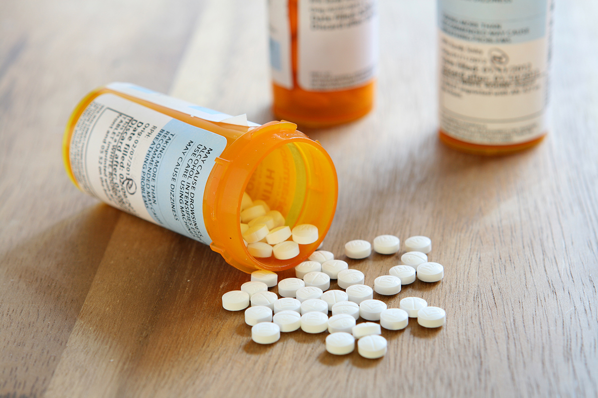 prescription pill bottle spilling showing Depressant vs Stimulant pills