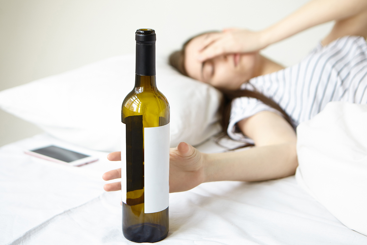woman struggling to sleep from alcohol and insomnia