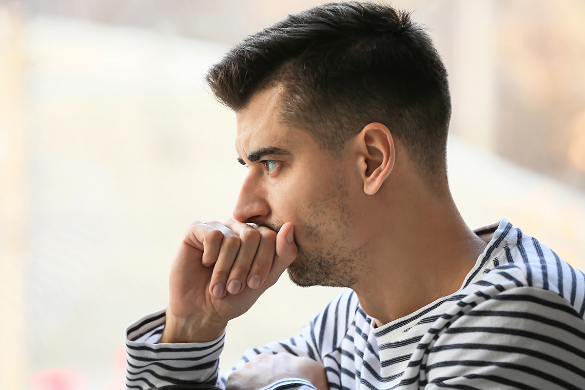man thinking about the signs of drug addiction
