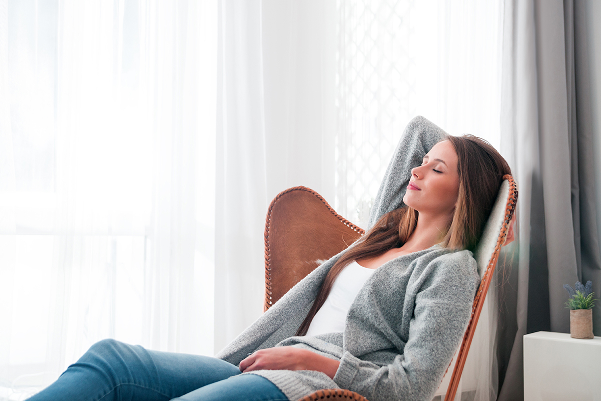 woman lounging in a chair at the inpatient detox center