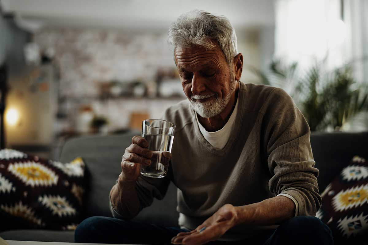 Man thinks about benefits of medical alcohol detox.