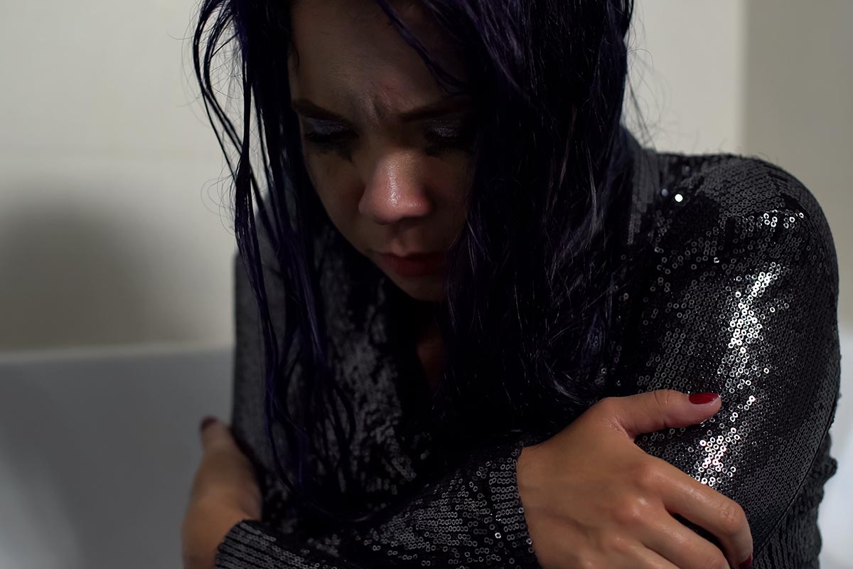 Woman struggles with the effects of heroin withdrawal